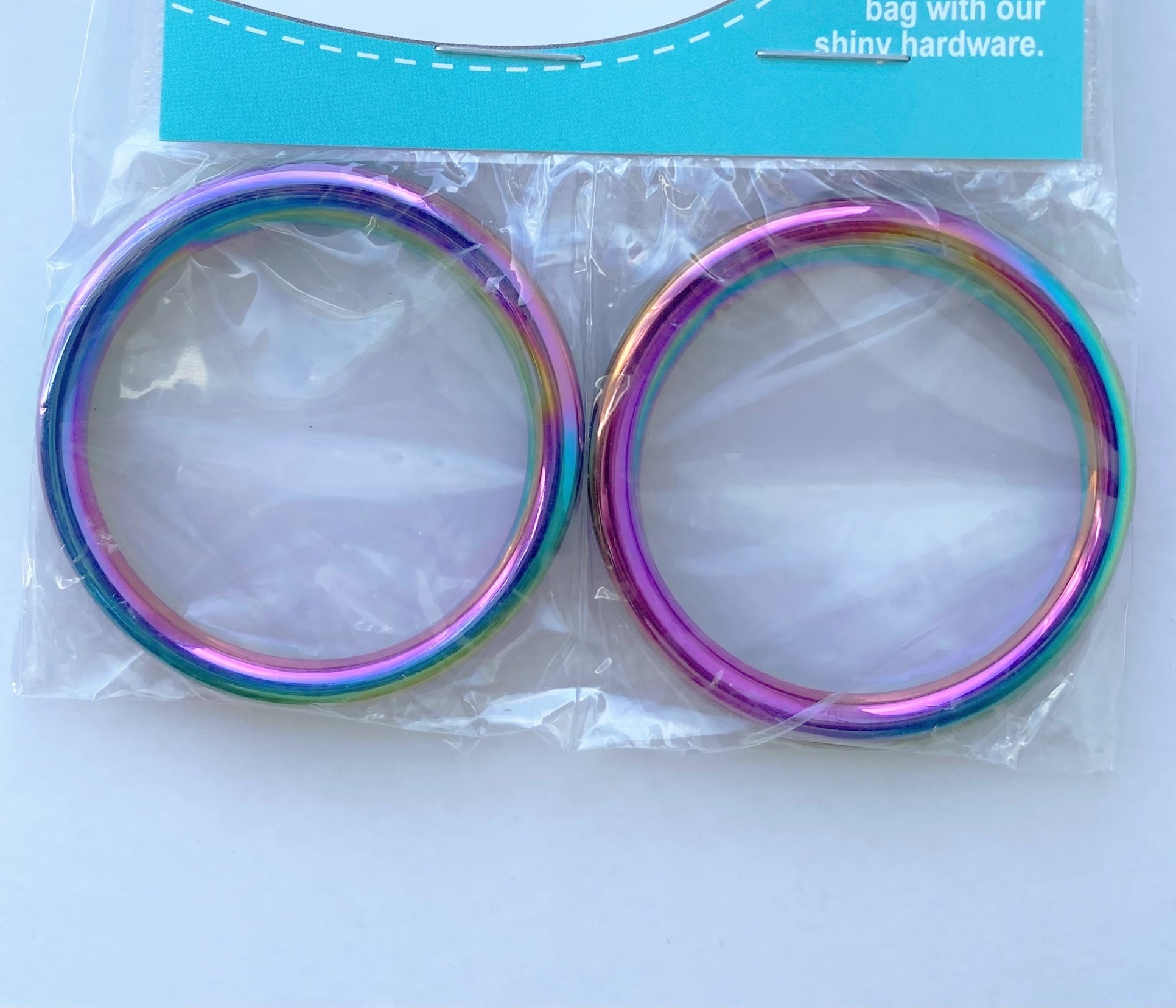 2022-02-19 13.39.01 Emmaline Bags O-Rings 1-1/2" in Iridescent Rainbow - Image 1
