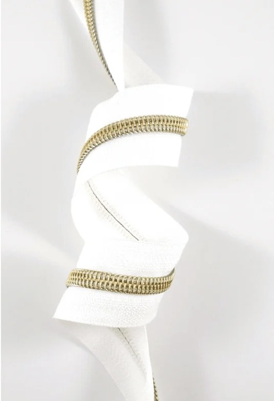 emmaline-zippers-by-the-yard-size5-does-not-include-sliderspullsemmaline-zippersemmaline-bags-inc-595427 Emmaline #5 Zips By the Yard White Tape with Light Gold Coil 3 yards - Image 1